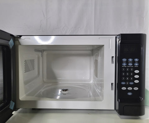 OSTER 1.1 CU. FT. COUNTERTOP MICROWAVE OVEN